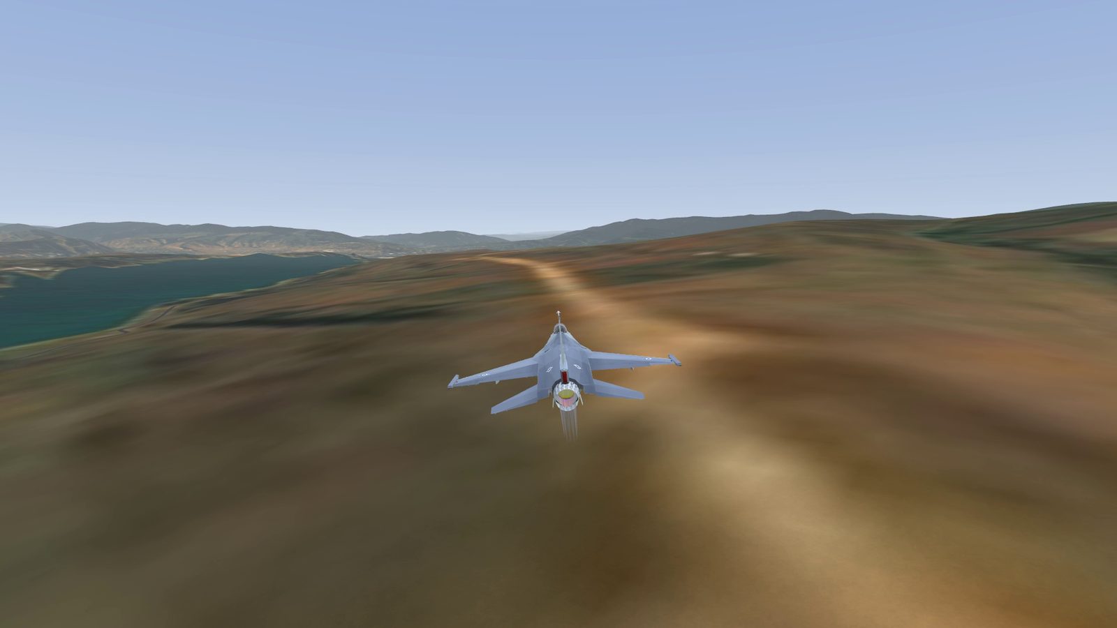 Chase camera, low over Tbilisi